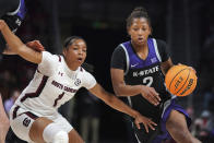 Kansas State guard Cymone Goodrich (2) drives against South Carolina guard Zia Cooke (1) during the first half of an NCAA college basketball game Friday, Dec. 3, 2021, in Columbia, S.C. (AP Photo/Sean Rayford)