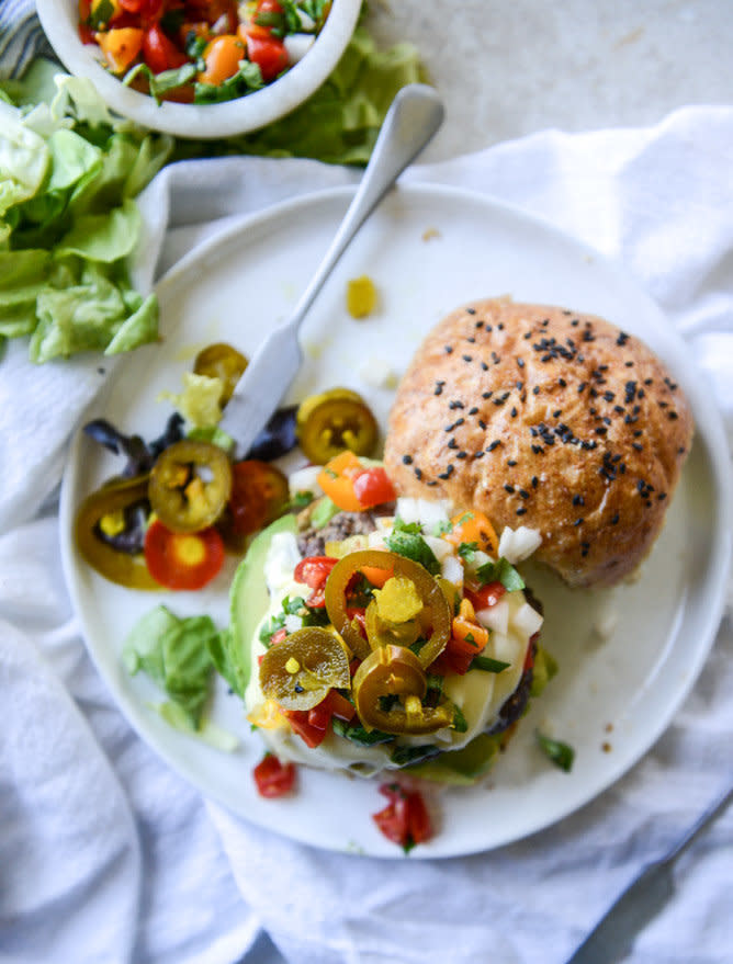 <strong>Get the <a href="http://www.howsweeteats.com/2016/05/queso-cheese-burgers-with-avocado-and-pico-de-gallo/" target="_blank">Queso Cheeseburger With Avocado And Pico De Gallo recipe</a>&nbsp;from How Sweet It Is</strong>