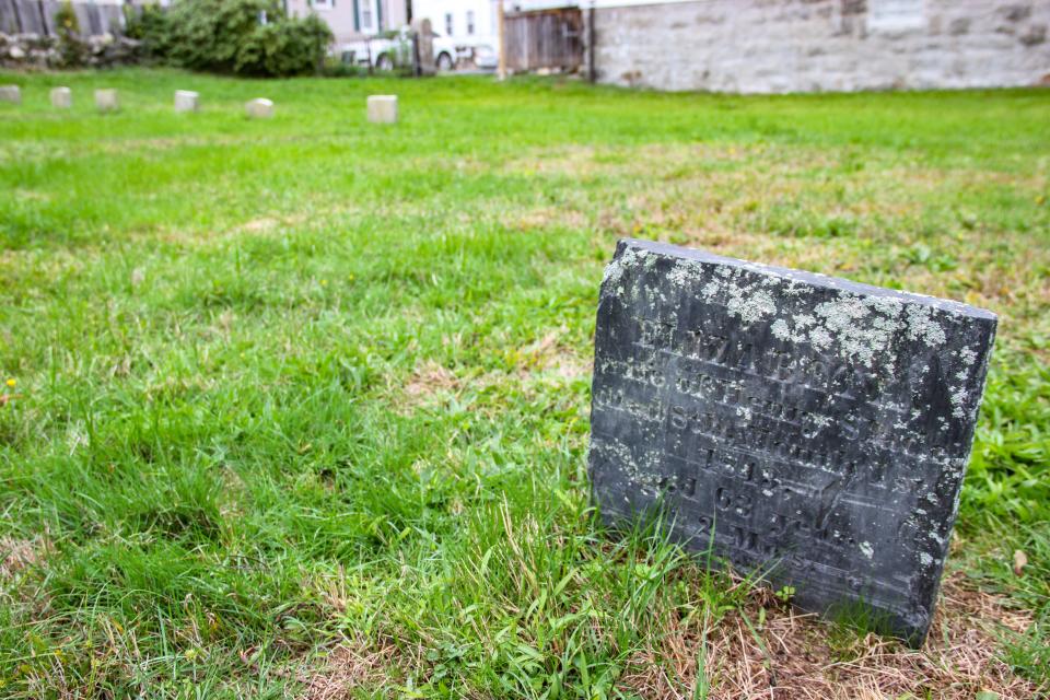 The gravestone of Elizabeth Slade stands at Fall River Friends Cemetery on Hood Street.