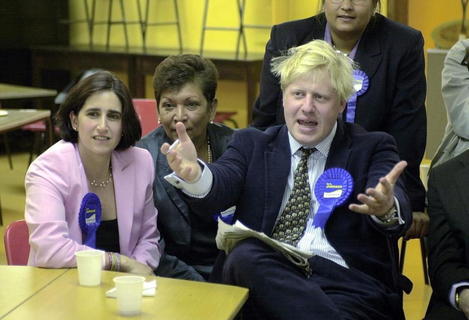 Boris Johnson watches the election results with wife Marina (l), in Watlington, Oxfordshire, after winning the Henley seat for the Conservatives in the 2001 General Election.  (PA)