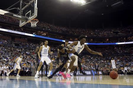 Mar 24, 2019; Columbus, OH, USA; North Carolina Tar Heels forward Nassir Little (5) and Washington Huskies guard Jaylen Nowell (5) go for a loose ball during the second half in the second round of the 2019 NCAA Tournament at Nationwide Arena. Mandatory Credit: Kevin Jairaj-USA TODAY Sports