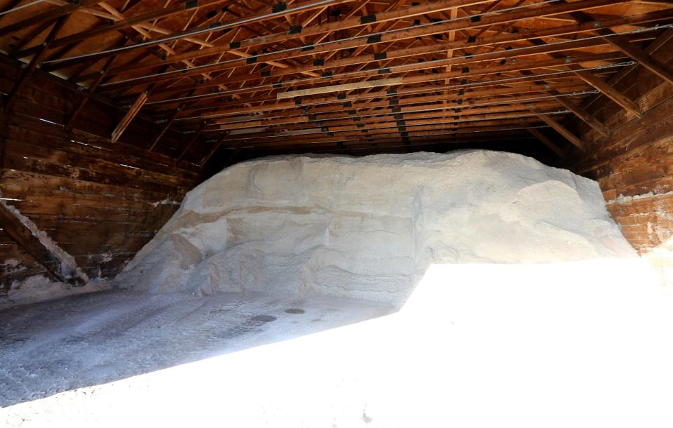 A pile of about 100 tons of road salt sits in a barn Tuesday, Dec. 20, 2022, at the St. Joseph County Highway Department’s Woodland District facility on New Road near Indiana 331. According to Greg Feitz, Woodland District group leader, the snow plows care for 12 routes out of the district facility, and it takes about 6 hours to complete. A typical winter snow event uses about 100 tons of salt.