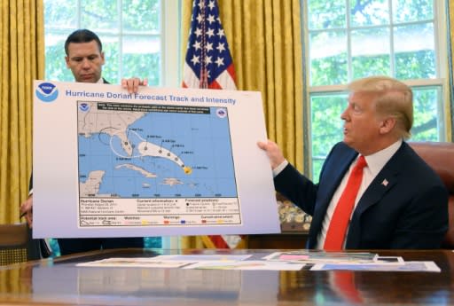 US President Donald Trump updates the media on Hurricane Dorian preparedness from the Oval Office at the White House