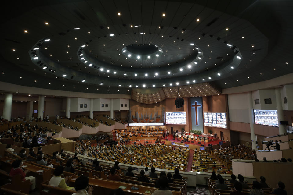 Christians wearing face masks as a precaution against the coronavirus attend while maintaining social distancing during an Easter service at the Yoido Full Gospel Church in Seoul, South Korea, Sunday, April 4, 2021. The church allowed only 20 percent members of the capacity to attend at the Easter service as a part of measure to prevent against the coronavirus. (AP Photo/Lee Jin-man)