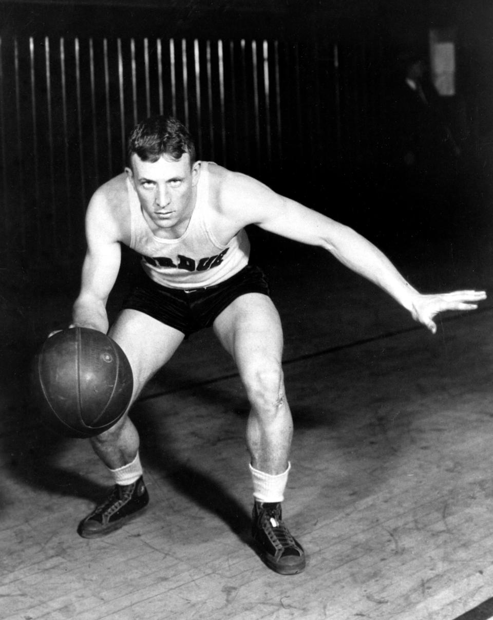 John Wooden, guard for Purdue University, poses in action in West Lafayette, Ind., in this undate photo. As a student at Purdue, Wooden was the All-American basketball player for three years, 1930-1932, and Player of the Year in 1932. (AP Photo)