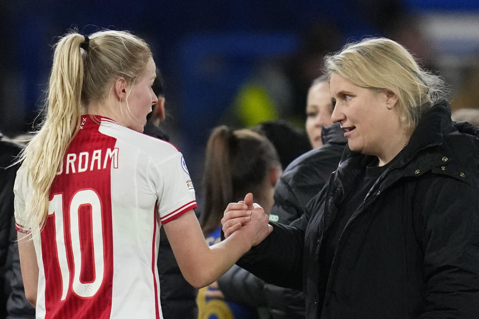 Chelsea's head coach Emma Hayes, right, shakes hands with Ajax's Nadine Noordam at the end of the Women's Champions League quarterfinal second leg soccer match between Chelsea and Ajax at Stamford Bridge Stadium in London, Wednesday, March 27, 2024. (AP Photo/Kirsty Wigglesworth)