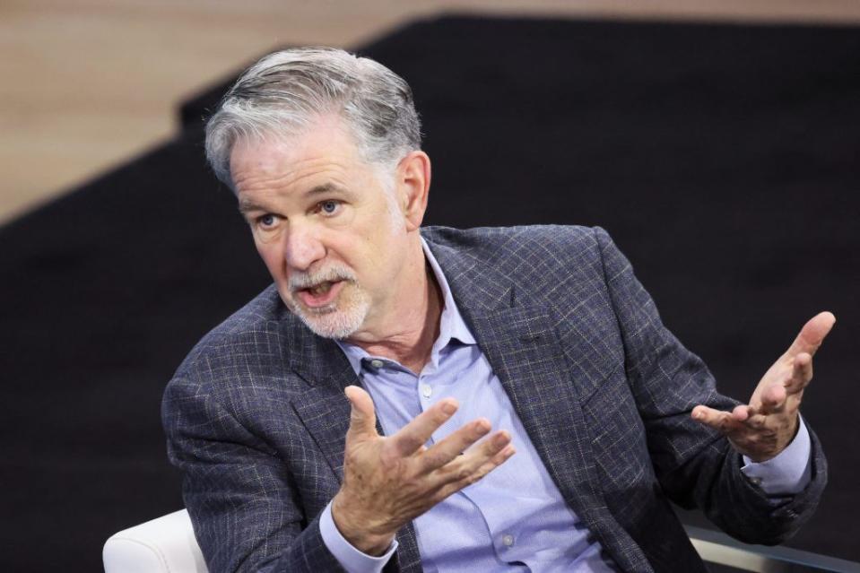 <a href="https://fortune.com/company/netflix/" target="_blank">Netflix</a> founder and Co-CEO Reed Hastings speaks at an event. He is mid-speech wearing a business suit and light purple business shirt.