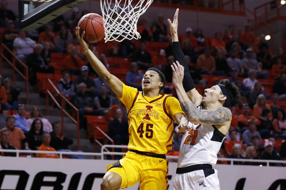Iowa State guard Rasir Bolton (45) shoots in front of Oklahoma State guard Lindy Waters III (21) in the second half of an NCAA college basketball game in Stillwater, Okla., Saturday, Feb. 29, 2020. (AP Photo/Sue Ogrocki)