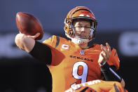 Cincinnati Bengals quarterback Joe Burrow (9) looks to pass against the Pittsburgh Steelers during the first half of an NFL football game, Sunday, Nov. 28, 2021, in Cincinnati. (AP Photo/Aaron Doster)