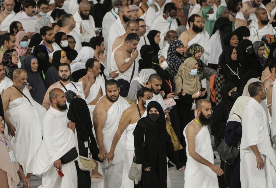 Muslim pilgrims circumambulate around the Kaaba, the cubic building at the Grand Mosque, in Mecca, Saudi Arabia, Wednesday, July 6, 2022. Muslim pilgrims are converging on Saudi Arabia's holy city of Mecca for the largest hajj since the coronavirus pandemic severely curtailed access to one of Islam's five pillars. (AP Photo/Amr Nabil)