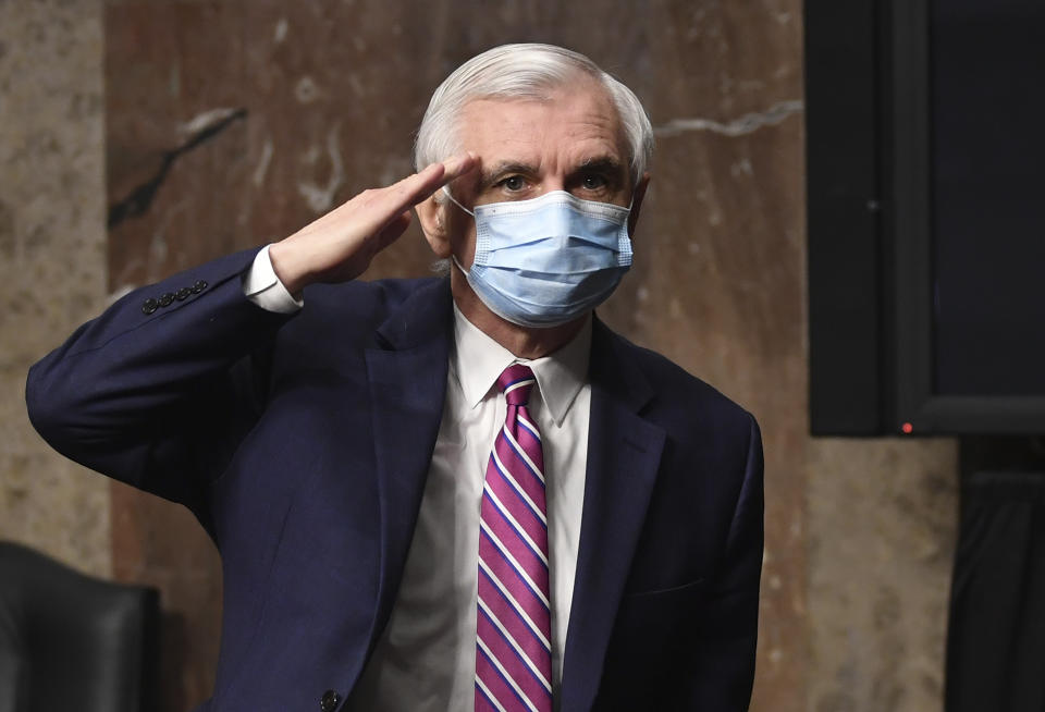 Ranking member Jack Reed, D-RI, salutes after a Senate Armed Services Committee hearing with testimony from witnesses Kenneth Braithwaite, nominated to be Secretary of the Navy, Gen. Charles Q. Brown, Jr., nominated for reappointment to the grade of General and to Chief of Staff of the U.S. Air Force, and James Anderson, nominated to be Deputy Under Secretary of Defense for Policy, on Capitol Hill in Washington, Thursday, May 7, 2020. (Kevin Dietsch/Pool via AP)