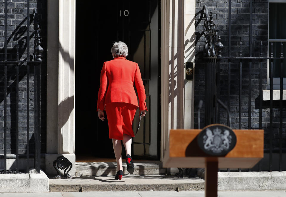 FILE - In this Friday, May 24, 2019 file photo, British Prime Minister Theresa May walks away after announcing her resignation, outside 10 Downing Street in London, England. British Prime Minister Theresa May has announced she will step down as leader of the Conservative Party on June 7, starting a process that will lead to a Conservative Party leadership contest and a new British prime minister who will lead the government during the Brexit process. (AP Photo/Alastair Grant, file)