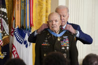 President Joe Biden awards the Medal of Honor to retired Army Col. Paris Davis for his heroism during the Vietnam War, in the East Room of the White House, Friday, March 3, 2023, in Washington. Davis, then a captain and commander with the 5th Special Forces Group, engaged in nearly continuous combat during a pre-dawn raid on a North Vietnamese army camp in the village of Bong Son in Binh Dinh province. (AP Photo/Evan Vucci)