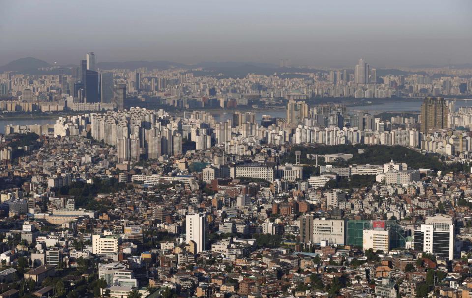 The skyline of central Seoul is seen during sunrise in Seoul