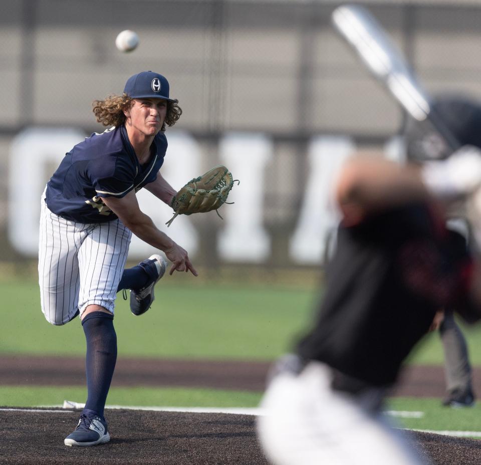 Hoban's Andrew Karhoff delivers against a Chardon batter during a Division I district semifinal May 23, 2023, in Canton.