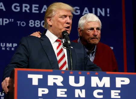 Former Indiana basketball coach Bobby Knight (R) departs after introducing Republican presidential nominee Donald Trump at a rally with supporters in Aston, Pennsylvania, U.S. September 22, 2016. REUTERS/Jonathan Ernst