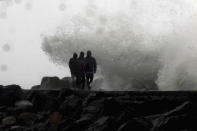 Waves hit the shore during a high tide at the Kasimedu Harbor on the Bay of Bengal coast in Chennai, India, Wednesday, Nov.25, 2020. India’s southern state of Tamil Nadu is bracing for Cyclone Nivar that is expected to make landfall on Wednesday. The state authorities have issued an alert and asked people living in low-lying and flood-prone areas to move to safer places. (AP Photo/R. Parthibhan)