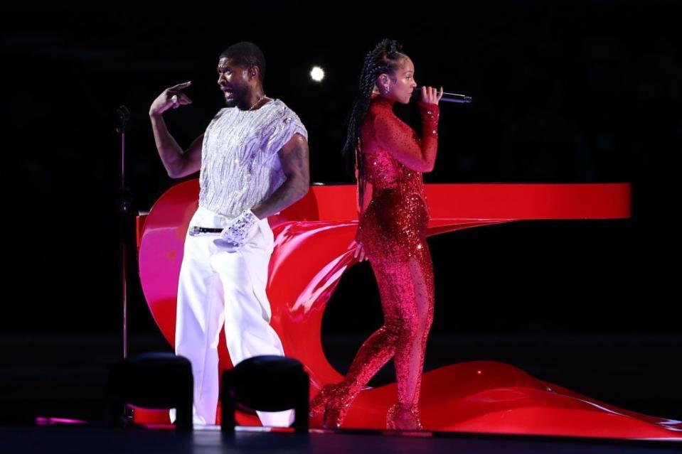 Usher and Alicia Keys perform onstage during the halftime show.