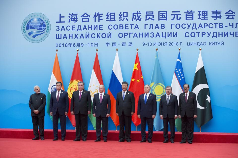 FILE - From left: Indian Prime Minister Narendra Modi, Tajikistan President Imomali Rakhmon, Russian President Vladimir Putin, Chinese President Xi Jinping, Kazakh President Nursultan Nazarbayev, Uzbekistan's President Shavkat Mirziyoyev and President of Pakistan Mamnoon Hussain pose for a photo prior to their talks at the Shanghai Cooperation Organization (SCO) Summit in Qingdao in eastern China's Shandong Province on June 10, 2018. China's leader Xi Jinping will travel to Kazakhstan and Uzbekistan starting Wednesday, Sept. 14, 2022 in his first trip abroad since the early days of the pandemic. China's Ministry of Foreign Affairs said in a short statement Monday that Xi will attend a meeting of the heads of state of the Shanghai Cooperation Organization in Samarkand while on the state visit to Uzbekistan. (AP Photo/Alexander Zemlianichenko, File)