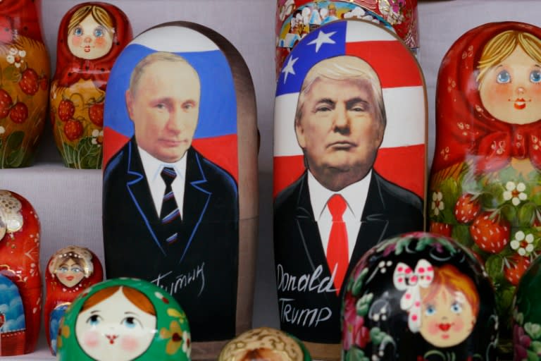 Russian dolls depicting Russian President Vladimir Putin (L) and his US counterpart Donald Trump are seen on sale at Izmailovo flea market in Moscow
