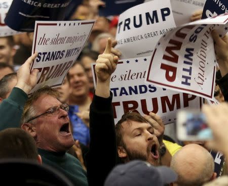 U.S. Republican presidential candidate Donald Trump supporters yell at a protesters as Trump speaks at campaign rally in Cleveland, Ohio March 12, 2016. REUTERS/Aaron Josefczyk