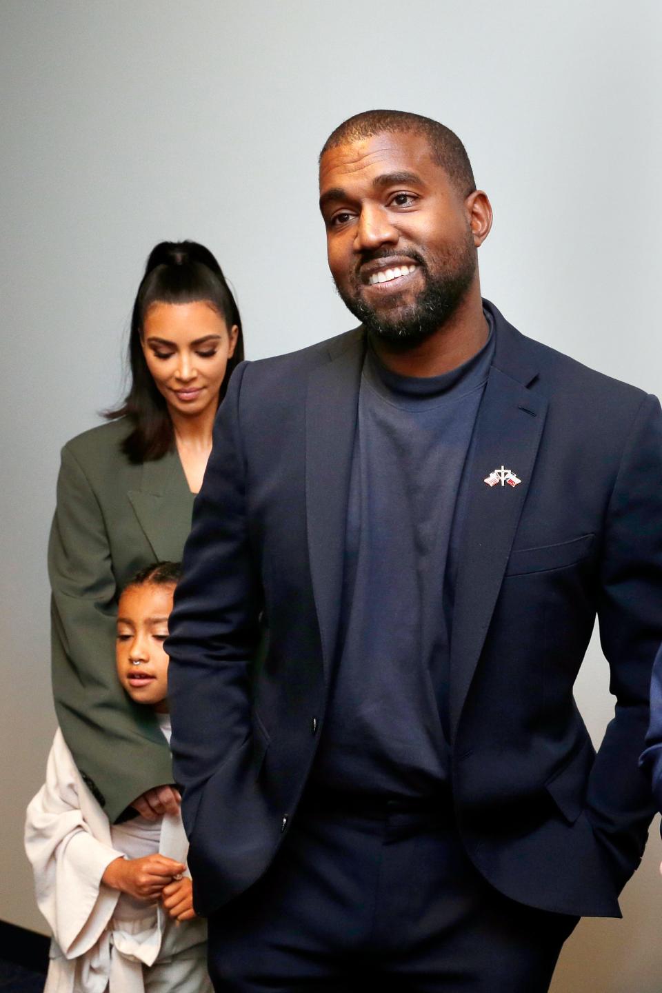 From left, Kim Kardashian West, North West and Kanye West answer media questions at Lakewood Church on Sunday, Nov. 17, 2019, in Houston.