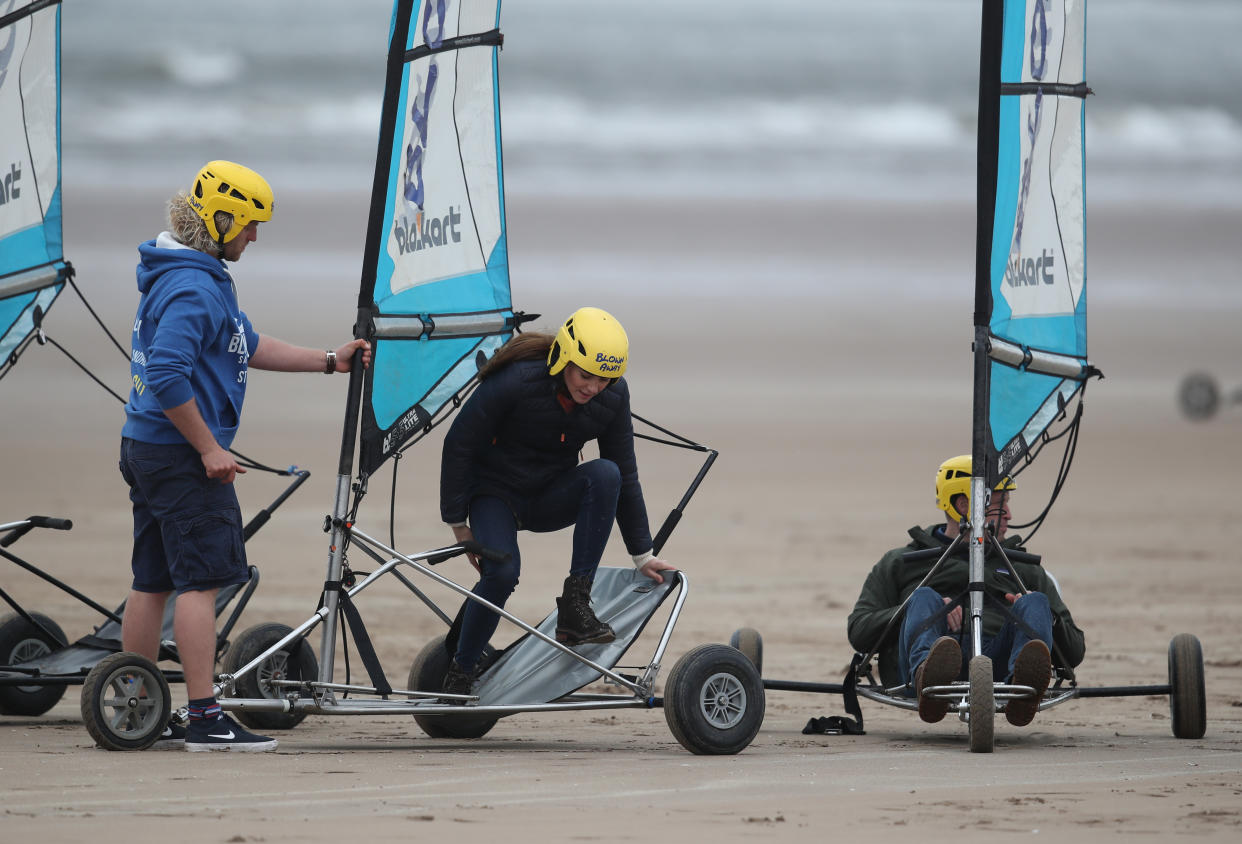 EMBARGOED UNTIL 1050 WEDNESDAY MAY 26 The Duke and Duchess of Cambridge with a group of young carers land yachting on the beach at St Andrews. Picture date: Wednesday May 26, 2021.