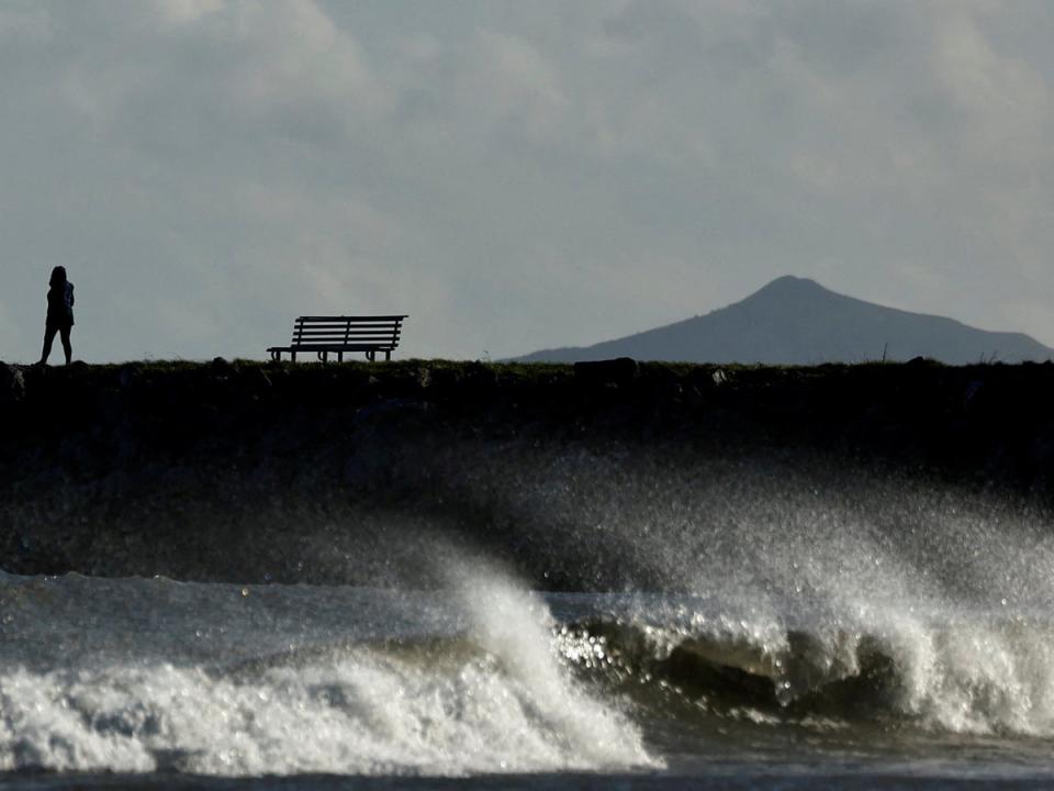 People have been told to stay away from the coast amid high winds and lashing waves (REUTERS)