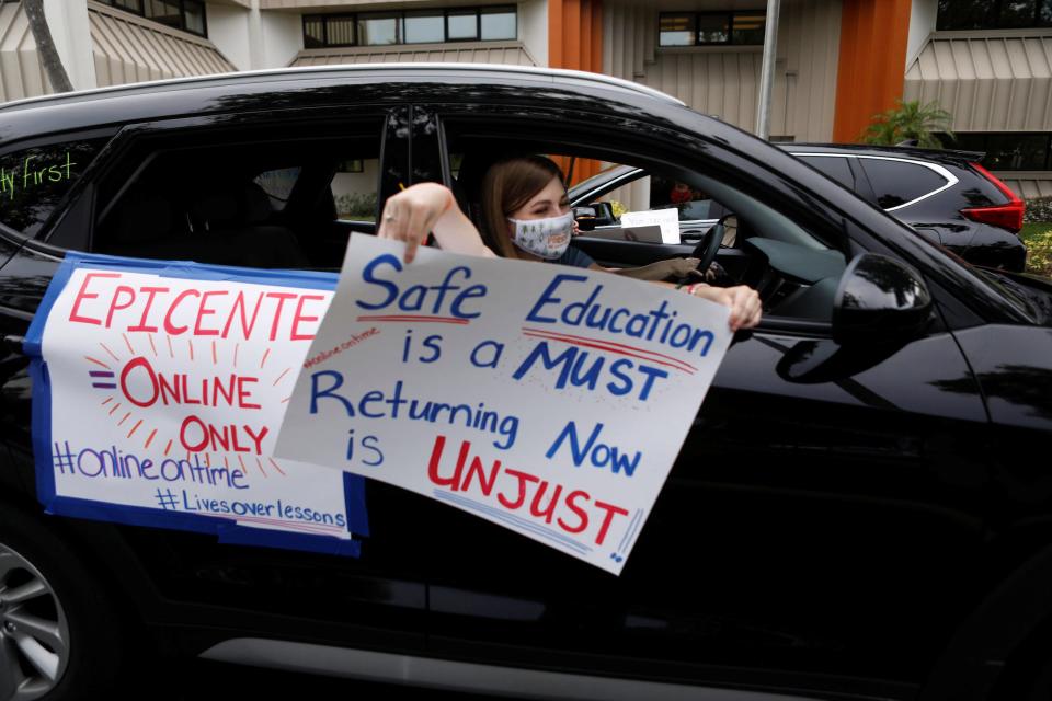 Florida teachers, whose unions are against their members returning to school, hold a car parade protest in front of the Pasco County School district office in Land O' Lakes, Florida, U.S. July 21, 2020.