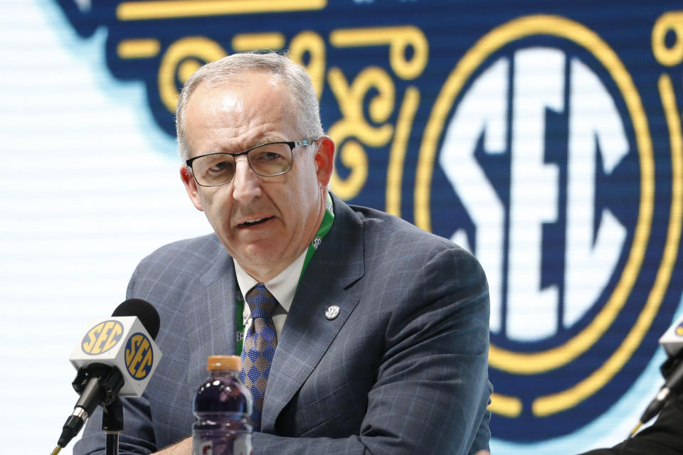 FILE - In this March 11, 2020, file photo, Southeastern Conference Commissioner Greg Sankey announces that fans will not be allowed in the arena to watch NCAA college basketball games in the SEC tournament in Nashville, Tenn. After the Power Five conference commissioners met Sunday, Aug. 9, 2020, to discuss mounting concern about whether a college football season can be played in a pandemic, players took to social media to urge leaders to let them play. (AP Photo/Mark Humphrey, File)