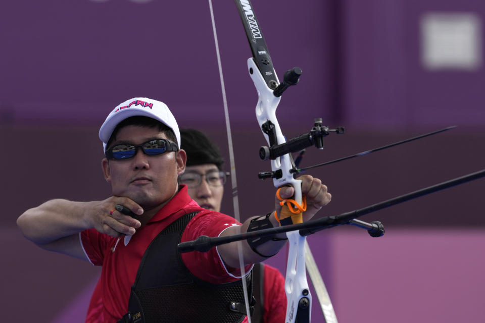 Japan's Takaharu Furukawa shoots an arrow during the men's team bronze medal match against the Netherlands at the 2020 Summer Olympics, Monday, July 26, 2021, in Tokyo, Japan. (AP Photo/Alessandra Tarantino)