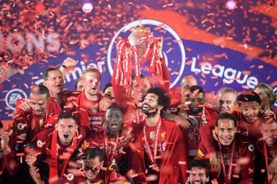 Liverpool celebrate lifting the Premier League trophy (POOL/AFP via Getty)