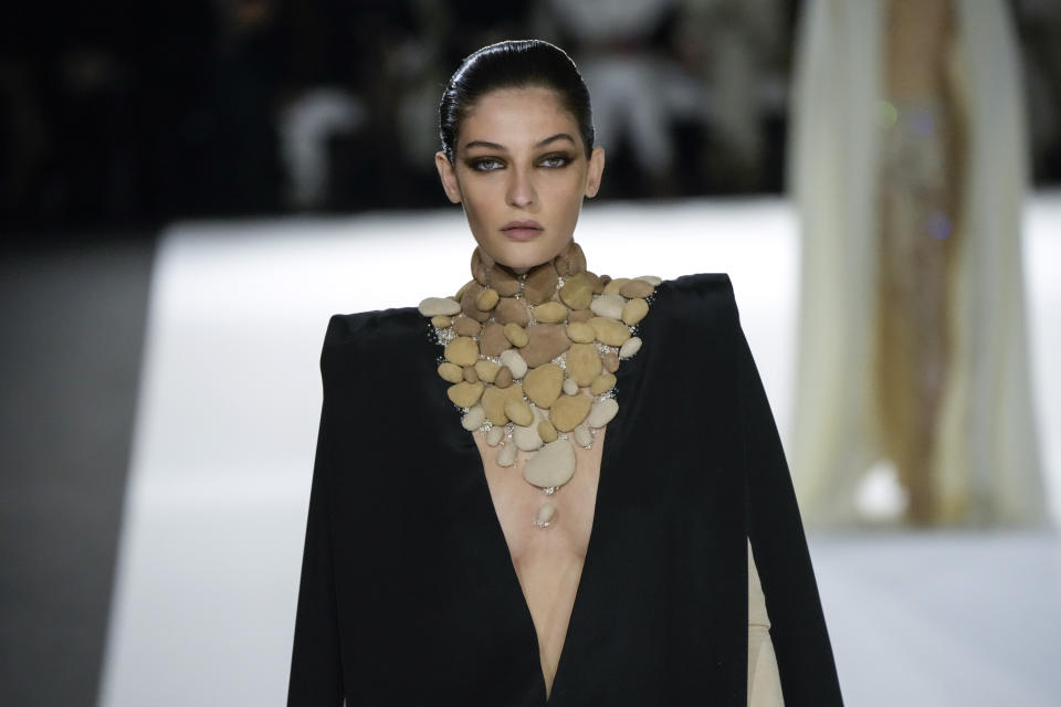 A model wears a creation for the Stephane Rolland Spring-Summer 2022 Haute Couture fashion collection, in Paris, Tuesday, Jan. 25, 2022. (AP Photo/Francois Mori)