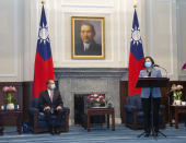 U.S. Health and Human Services Secretary Alex Azar, left, listens as Taiwan's President Tsai Ing-wen speaks during a meeting in Taipei, Taiwan Monday, Aug. 10, 2020. Azar met with Tsai on Monday during the highest-level visit by an American Cabinet official since the break in formal diplomatic ties between Washington and Taipei in 1979. (Pool Photo via AP Photo)