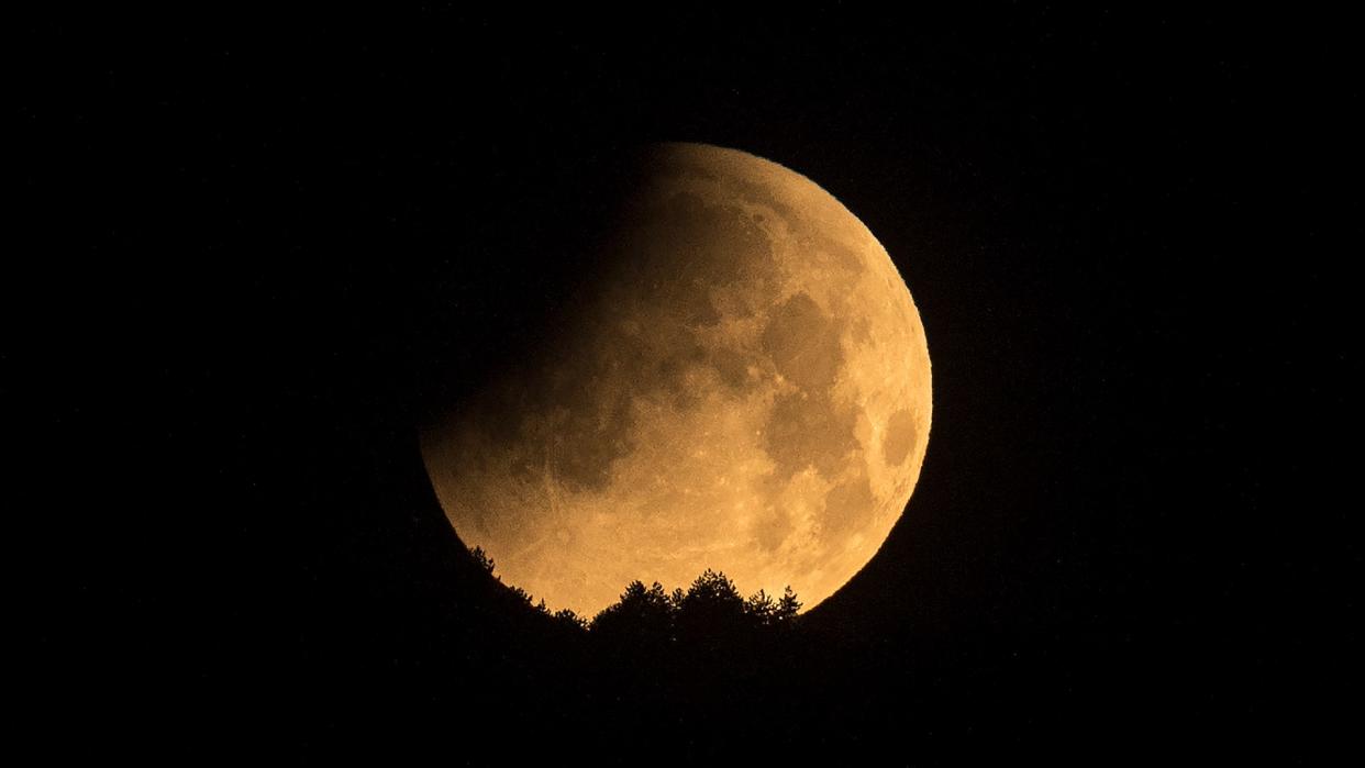  The moon is seen during a penumbral lunar eclipse in Skopje, North Macedonia on May 16, 2022. 