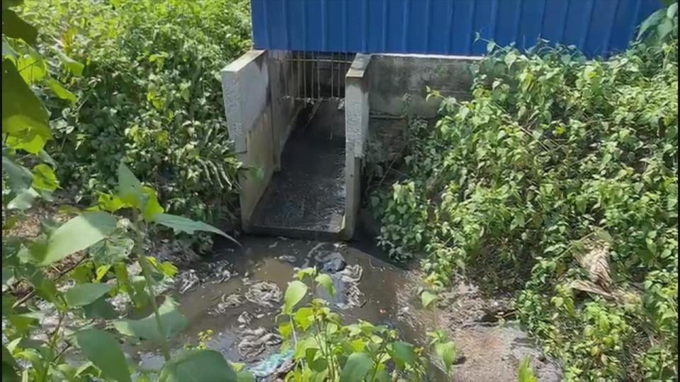 PHOTO: Waste-water being discharged from a Malaysian plastic manufacturing facility where a plastic bag tracker deployed by ABC News last pinged. The discharge empties into a drainage ditch that leads directly to a nearby river. (ABC News)