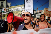 People shout slogans during a demonstration against evictions and rising of rent prices in central Lisbon, Portugal September 22, 2018. REUTERS/Pedro Nunes