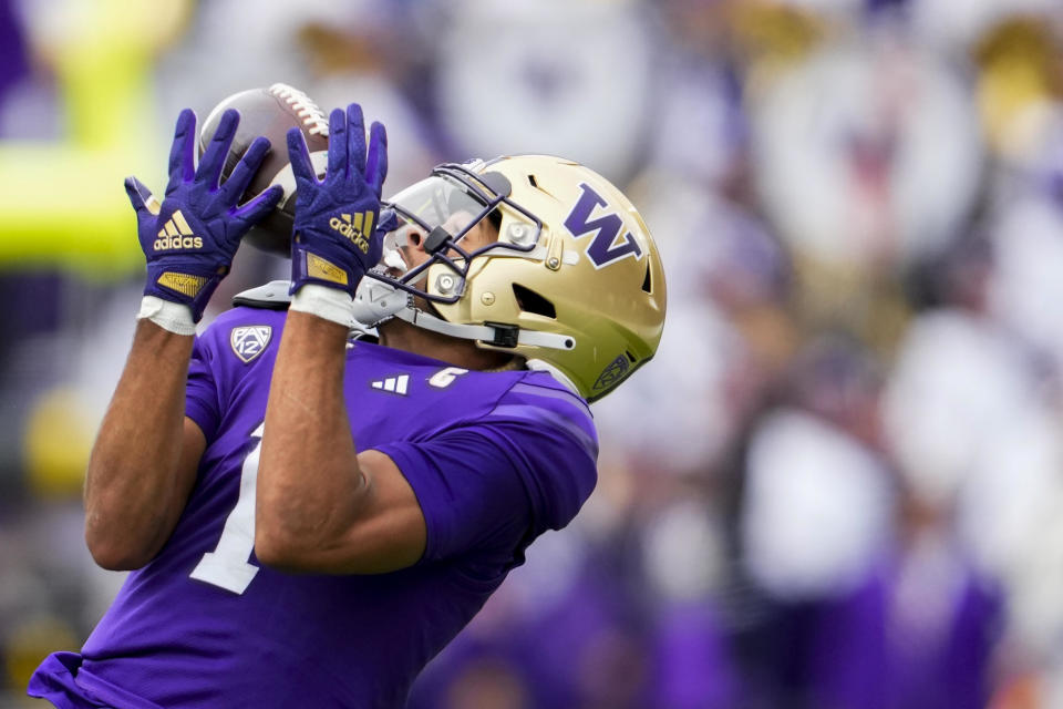 FILE - Washington wide receiver Rome Odunze makes a catch against Oregon during the first half of an NCAA college football game, Saturday, Oct. 14, 2023, in Seattle. Odunze has been selected to The Associated Press midseason All-America team, Wednesday, Oct. 18, 2023. / Credit: Lindsey Wasson / AP