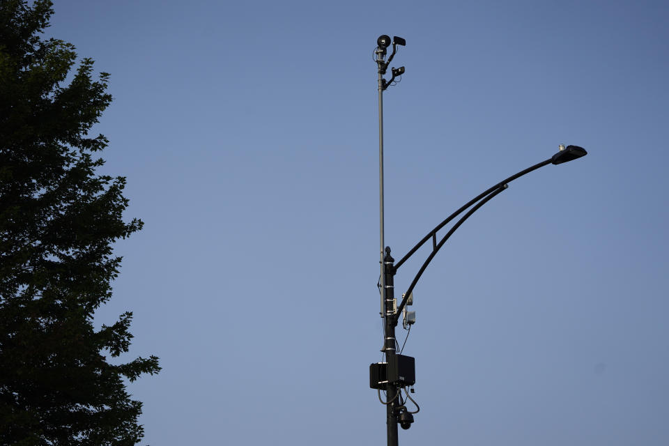 FILE - ShotSpotter equipment overlooks the intersection of South Stony Island Avenue and East 63rd Street in Chicago on Aug. 10, 2021. Chicago won't renew its contract for the controversial gunshot detection system and end the use of ShotSpotter technology later this year, Mayor Brandon Johnson’s office announced Tuesday, Feb. 13, 2024. (AP Photo/Charles Rex Arbogast, file)