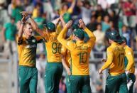 South Africa's Chris Morris (L) is congratulated by his teammates after taking the wicket of Afghanistan's Mohammad Shahzad. South Africa v Afghanistan - World Twenty20 cricket tournament - Mumbai, India, 20/03/2016. REUTERS/Danish Siddiqui