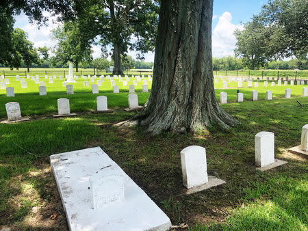 Markes for former leprosy patients line a graveyard in the former leprosy colony at what is now the Gillis W. Long National Guard Center in Carville, Louisiana, U.S., July 6, 2018. REUTERS/Joshua Schneyer