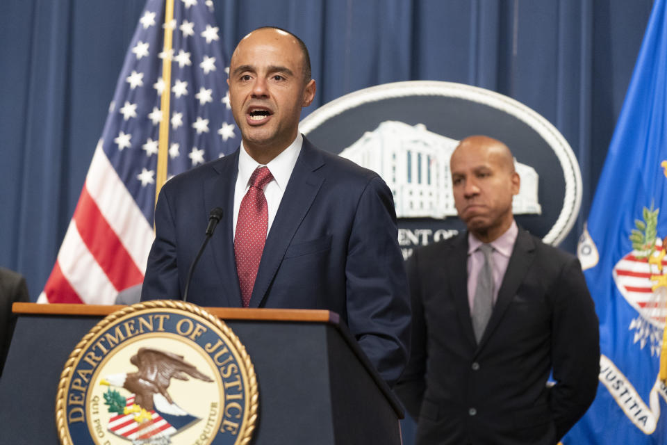 U.S. Attorney Matthew Graves for the District of Columbia, with Under Secretary of the Treasury for Terrorism and Financial Intelligence Brian Nelson, right, speaks during a news conference, Tuesday, April 25, 2023, at the Justice Department in Washington. The Justice Department says British American Tobacco has agreed to a $629 million settlement to resolve allegations that it did illegal business with North Korea. In addition, federal prosecutors disclosed a cigarette trafficking scheme that raised money for North Korea's nuclear weapons program, announcing charges against three men — a North Korean banker and two Chinese facilitators. (AP Photo/Manuel Balce Ceneta)