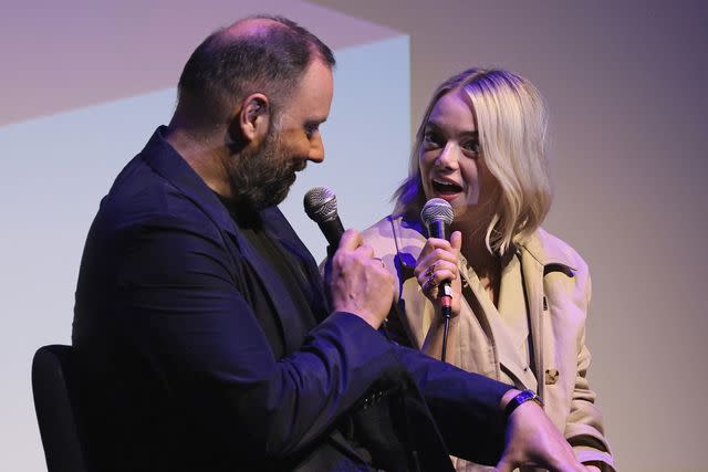 <p>Dimitrios Kambouris/Getty</p> Yorgos Lanthimos and Emma Stone at NYFF