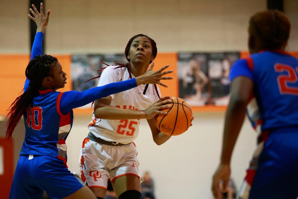 Orange Park's Nia Brown (25) looks to shoot against Pine Forest during the Class 5A girls basketball playoffs in 2022.