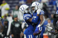 Indianapolis Colts' Bobby Okereke (58) celebrates his interception with George Odum (30) during the second half of an NFL football game against the New York Jets, Thursday, Nov. 4, 2021, in Indianapolis. (AP Photo/AJ Mast)