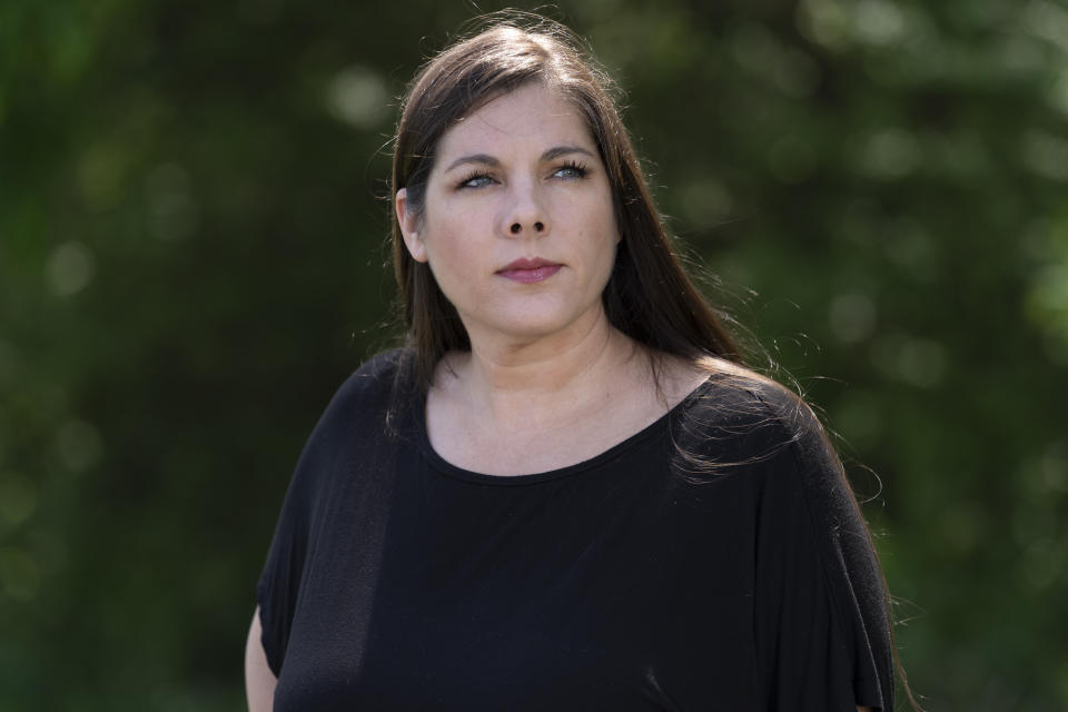 Charlena Aumiller poses for a portrait on Tuesday, May 9, 2023, in Hendersonville, Tenn. A lawyer who previously worked for the Tennessee Attorney General’s Office, Aumiller has become a local government watchdog – chronicling the county commission's actions with regular posts on a public social media page and filing a lawsuit against the commission that claimed, in part, violations of the state's open meetings law. (AP Photo/George Walker IV)