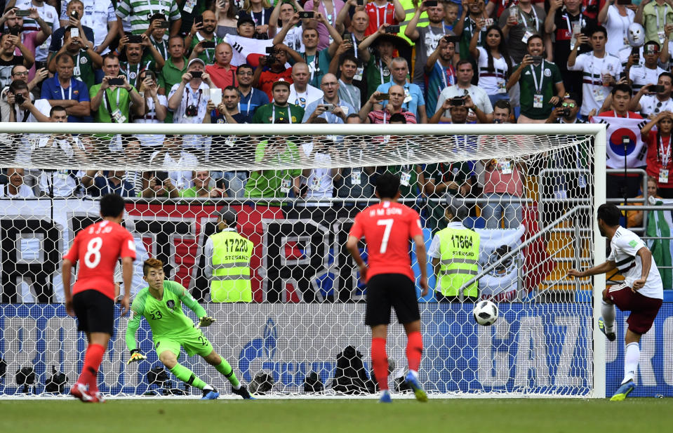 <p>Mexico’s Carlos Vela, right, scores his side’s opening goal from a penalty kick during the group F match between Mexico and South Korea. </p>