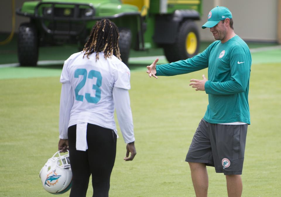 Adam Gase (right) traded Ajayi to Philadelphia for a fourth-round draft pick