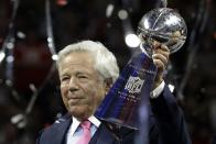 FILE - In this Feb. 3, 2019, file photo, New England Patriots owner Robert Kraft holds the Vince Lombardi trophy after the NFL Super Bowl 53 football game against the Los Angeles Rams, in Atlanta. Police in Florida have charged New England Patriots owner Robert Kraft with misdemeanor solicitation of prostitution, saying they have videotape of him paying for a sex act inside an illicit massage parlor. Jupiter police told reporters Friday, Feb. 22, 2019, that the 77-year-old Kraft has not been arrested. (AP Photo/Mark Humphrey, File)