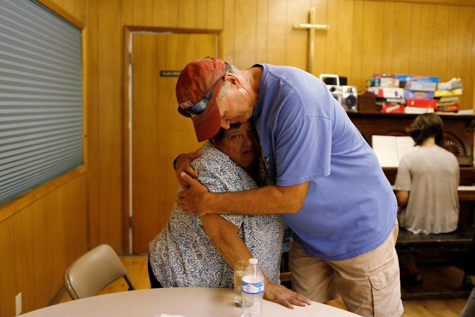 Pastor Craig Paschal hugs Rosa’s mother